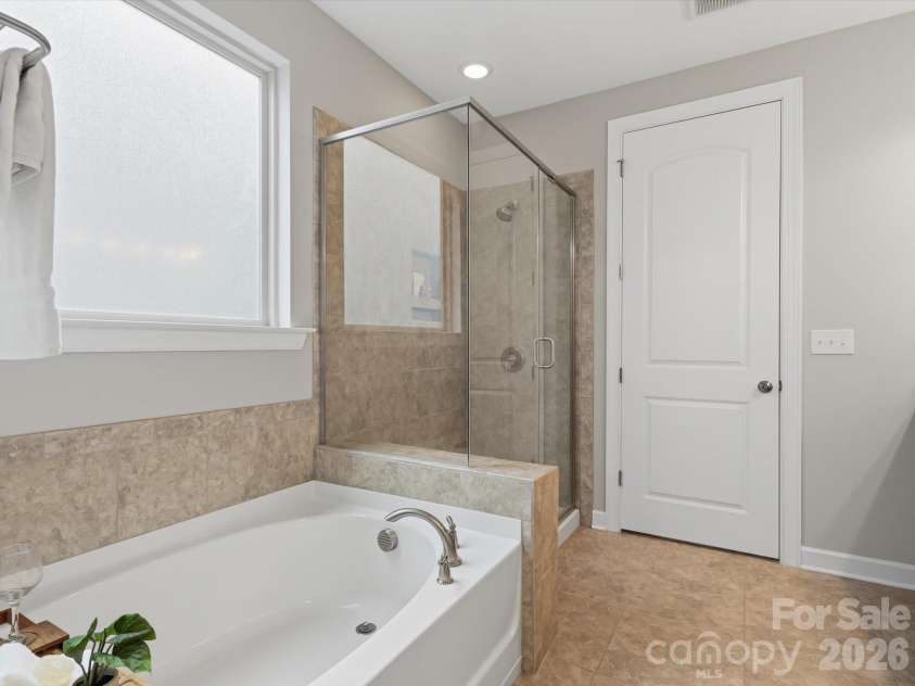 5353 Baker Lane, Clover, SC 29710.  MLS# CAR4401671, YatesRealty ID 39994. Primary Bathroom with soaking tub and separate shower.