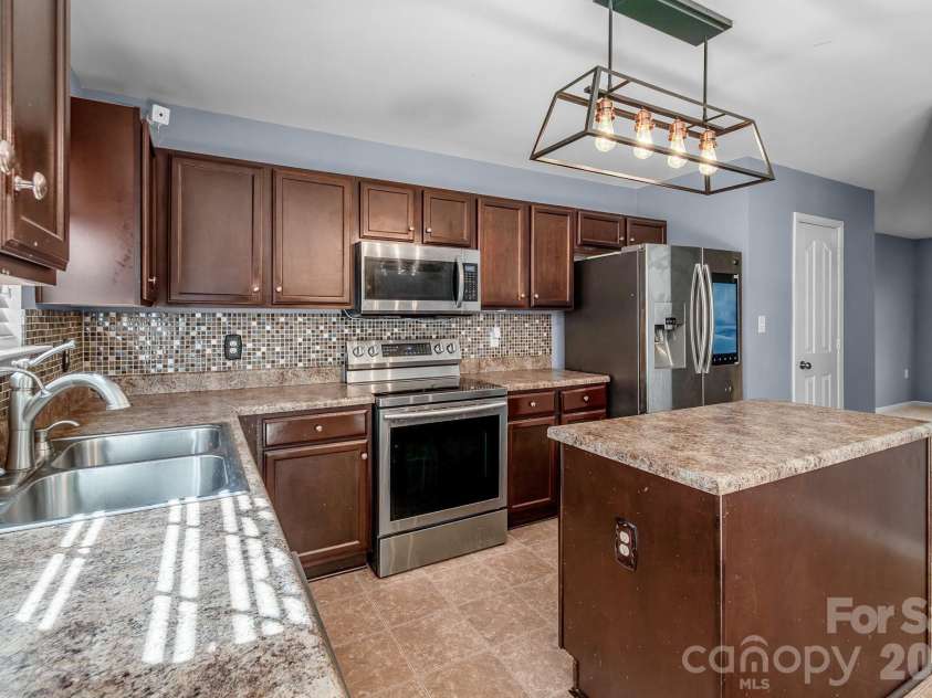 9520 Eagle Feathers Drive, Charlotte, NC 28214.  MLS# CAR4357175, YatesRealty ID 4000. 