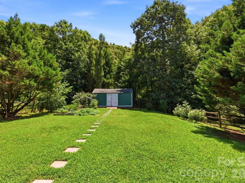 2020 White Cedar Lane, Waxhaw, NC 28173.  MLS# CAR4404030, YatesRealty ID 40006. A deep garden, bordered in mature trees is ready for you back yard plans. Perhaps a pool or a playground?