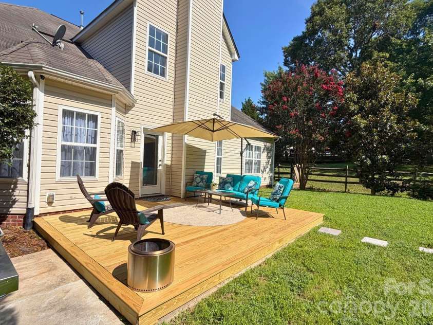 2020 White Cedar Lane, Waxhaw, NC 28173.  MLS# CAR4404030, YatesRealty ID 40006. A grilling patio off the deck is a great feature!