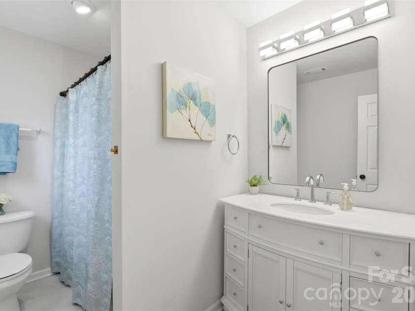 2020 White Cedar Lane, Waxhaw, NC 28173.  MLS# CAR4404030, YatesRealty ID 40006. Common bath off hallway on upper level boasts updated lighting and gorgeous new vanity!
