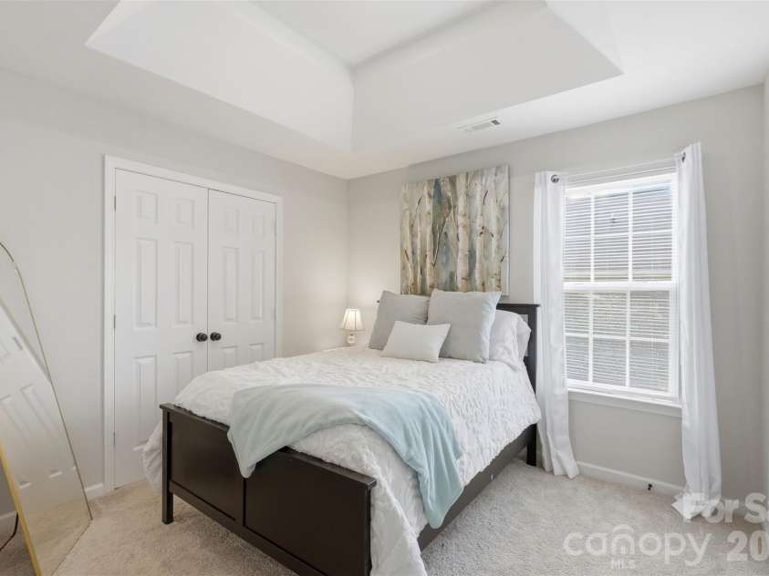 2020 White Cedar Lane, Waxhaw, NC 28173.  MLS# CAR4404030, YatesRealty ID 40006. This guest room is flanked by two closets.