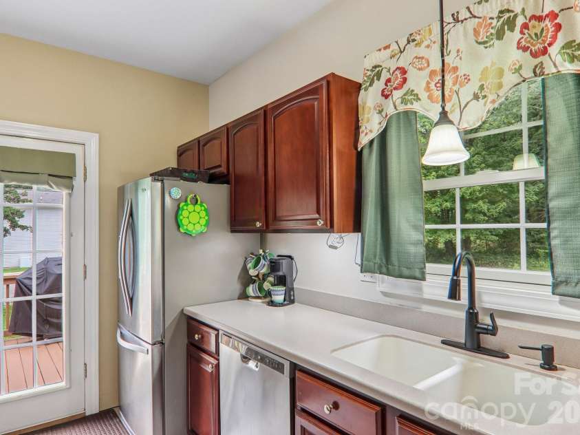 3311 Sandy Drive, Hendersonville, NC 28792.  MLS# CAR4406829, YatesRealty ID 40014. Door opens to freshly-stained side deck