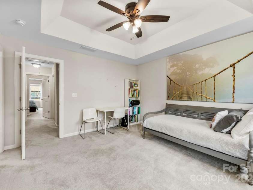 7223 Lochy Lane, Charlotte, NC 28278.  MLS# CAR4298541, YatesRealty ID 40020. Secondary bedroom is roomy with tray ceilings and a private, ensuite bathroom.