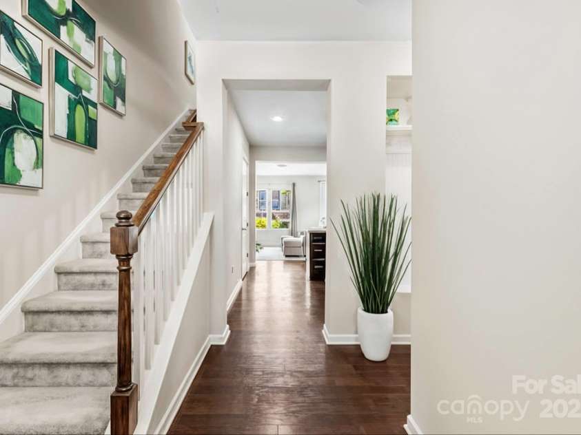 7223 Lochy Lane, Charlotte, NC 28278.  MLS# CAR4298541, YatesRealty ID 40020. Soft, carpeted stairs lead to both upstairs bedrooms. Some accessories have been enhanced by virtual staging.