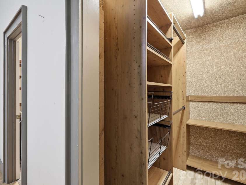 222 Morgan Cove Road, Candler, NC 28715.  MLS# CAR4403982, YatesRealty ID 40029. 2nd Level Storage Closet