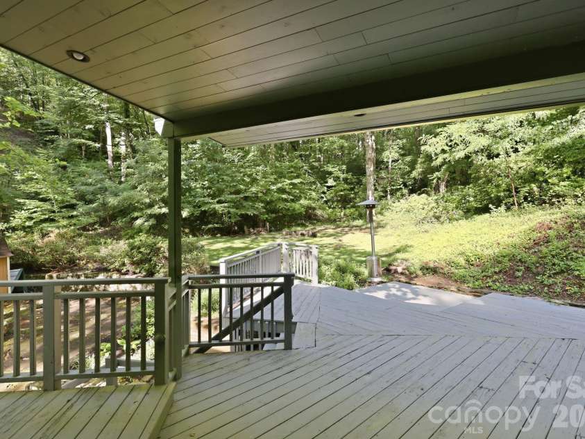 222 Morgan Cove Road, Candler, NC 28715.  MLS# CAR4403982, YatesRealty ID 40029. Covered Portion of Rear Deck