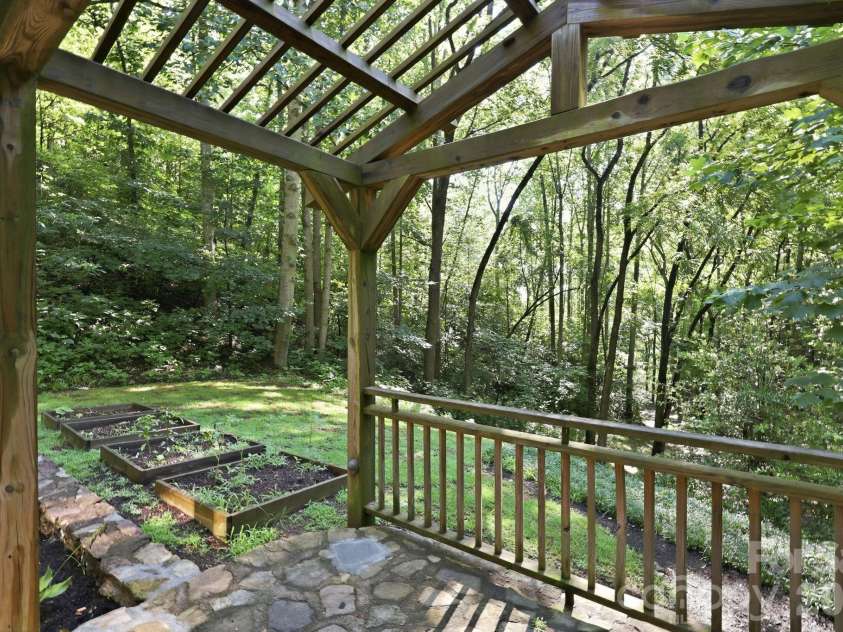 222 Morgan Cove Road, Candler, NC 28715.  MLS# CAR4403982, YatesRealty ID 40029. Front Patio w/Pergola