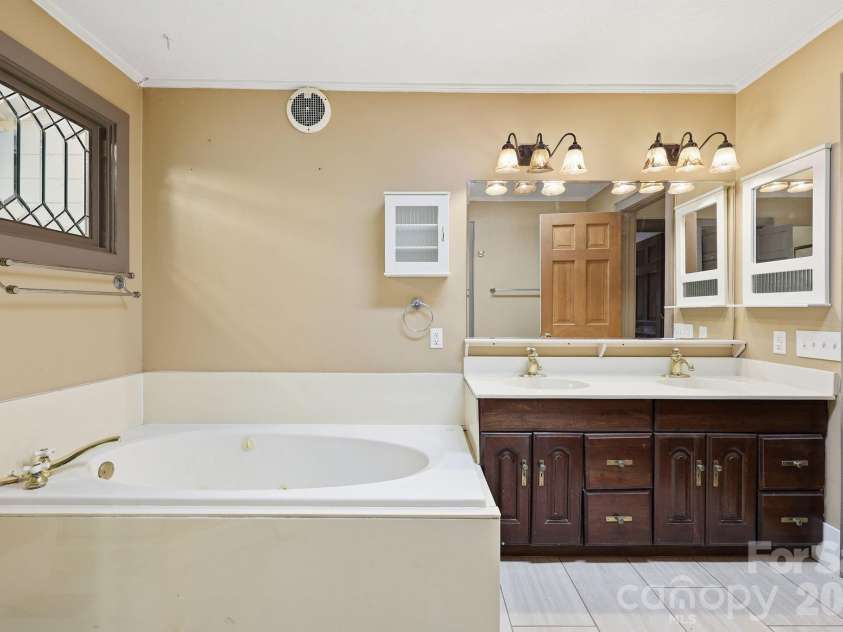 222 Morgan Cove Road, Candler, NC 28715.  MLS# CAR4403982, YatesRealty ID 40029. Full Primary/Hall Bathroom