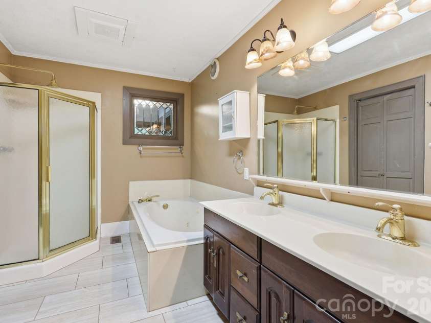 222 Morgan Cove Road, Candler, NC 28715.  MLS# CAR4403982, YatesRealty ID 40029. Main Level