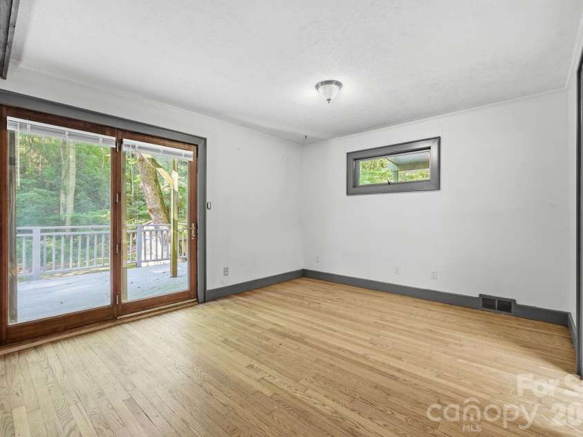 222 Morgan Cove Road, Candler, NC 28715.  MLS# CAR4403982, YatesRealty ID 40029. Primary Bedroom