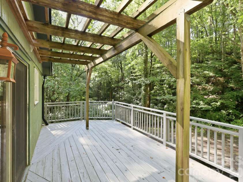 222 Morgan Cove Road, Candler, NC 28715.  MLS# CAR4403982, YatesRealty ID 40029. Side Deck w/Pergola