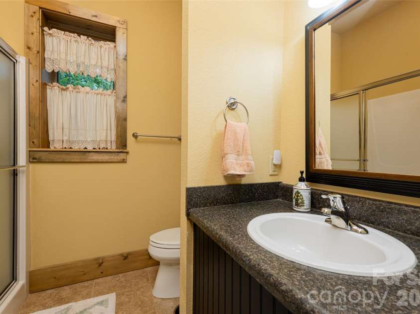 649 Panoramic Loop, Maggie Valley, NC 28751.  MLS# CAR4360546, YatesRealty ID 40031. Lower bathroom