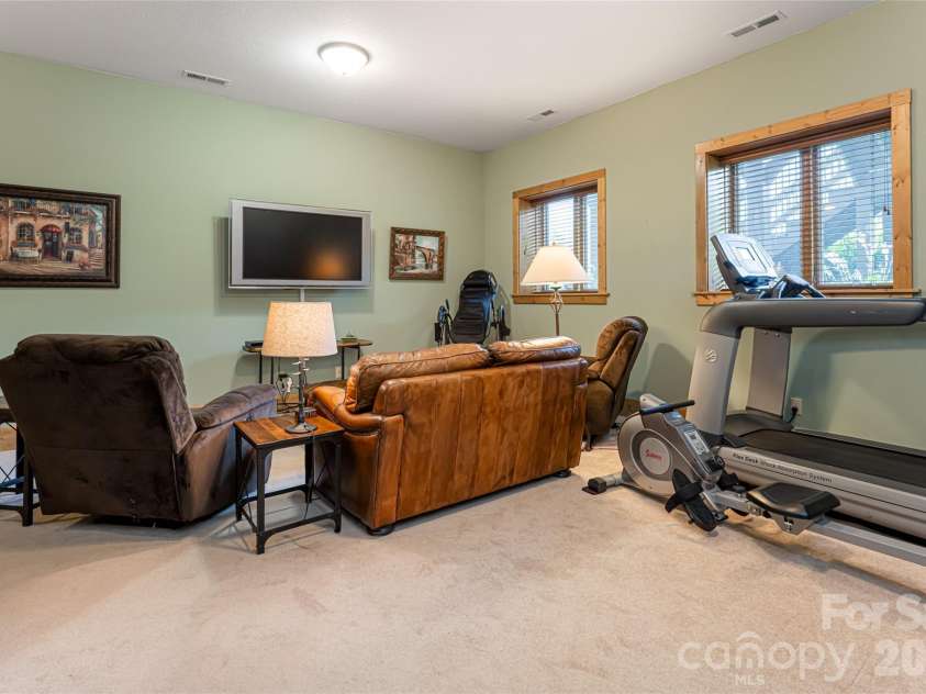 649 Panoramic Loop, Maggie Valley, NC 28751.  MLS# CAR4360546, YatesRealty ID 40031. Lower family room