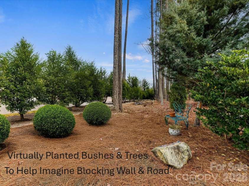 3619 Savannah Hills Drive, Matthews, NC 28105.  MLS# CAR4325650, YatesRealty ID 4004. Virtually planted trees and bushes to show how to help block wall and road