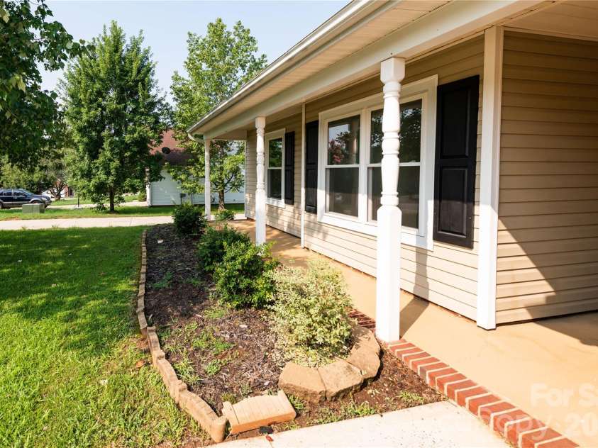 266 Kendra Drive, Concord, NC 28025.  MLS# CAR4401162, YatesRealty ID 40046. Beautiful front porch with natural shade