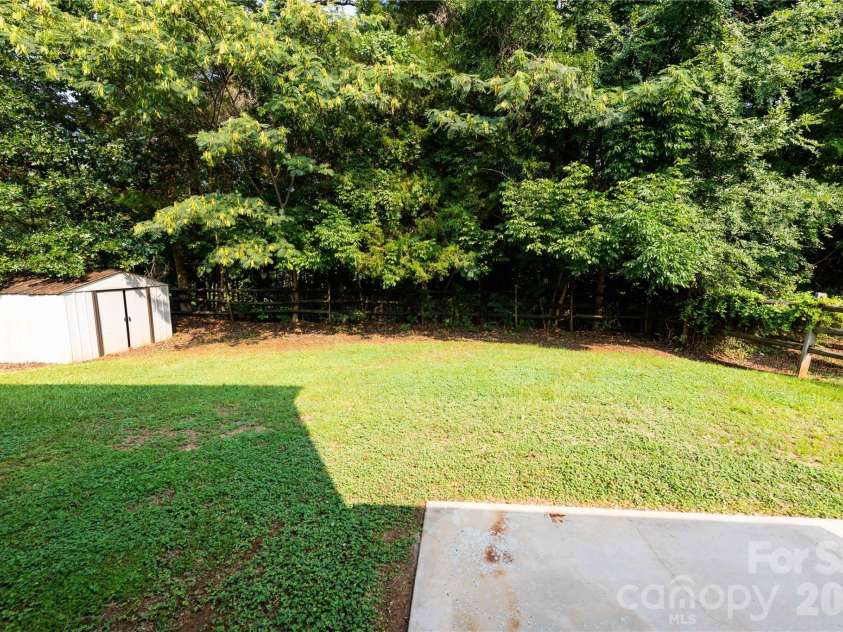 266 Kendra Drive, Concord, NC 28025.  MLS# CAR4401162, YatesRealty ID 40046. Large private backyard with split rail fencing