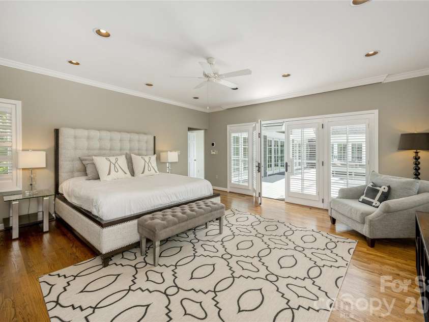 20 Inglewood Road, Asheville, NC 28804.  MLS# CAR4392997, YatesRealty ID 40056. Main level primary bedroom with access to deck