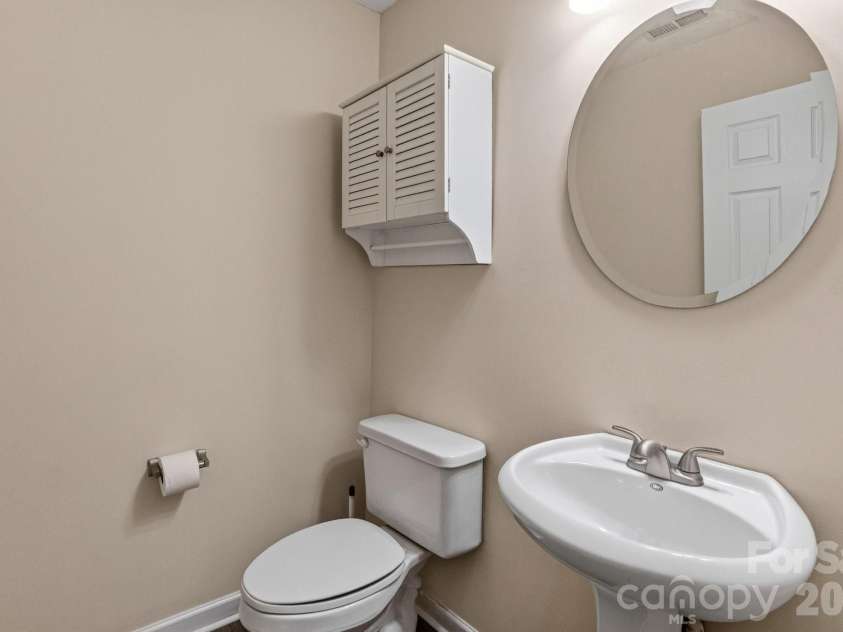 8318 Christmas Court, Charlotte, NC 28216.  MLS# CAR4407255, YatesRealty ID 40061. Half Bath Main level