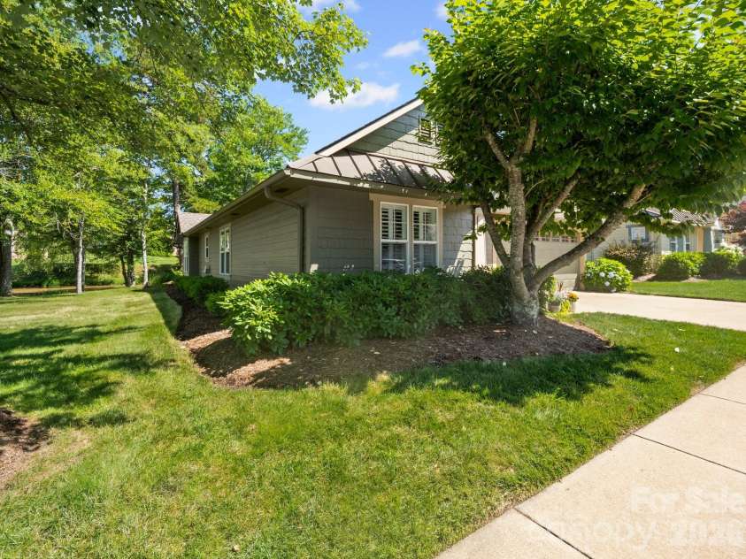 10 Gray Wolf Lane, Hendersonville, NC 28792.  MLS# CAR4267115, YatesRealty ID 4009. Side Green Area