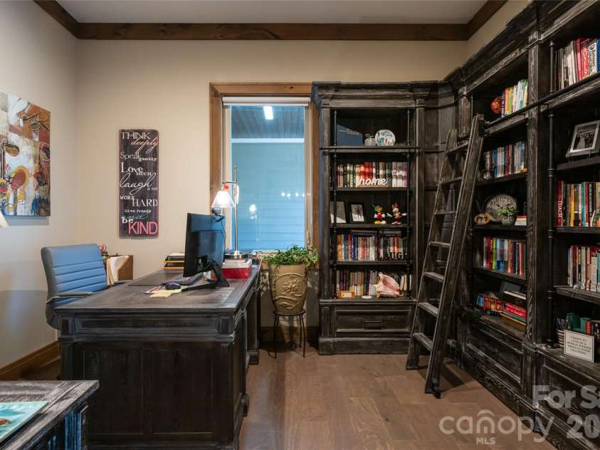 660 Pleasant Grove Road, Hendersonville, NC 28739.  MLS# CAR4406497, YatesRealty ID 40090. Currently serving as a bright home office, this versatile space can easily be adapted to fit your needs.