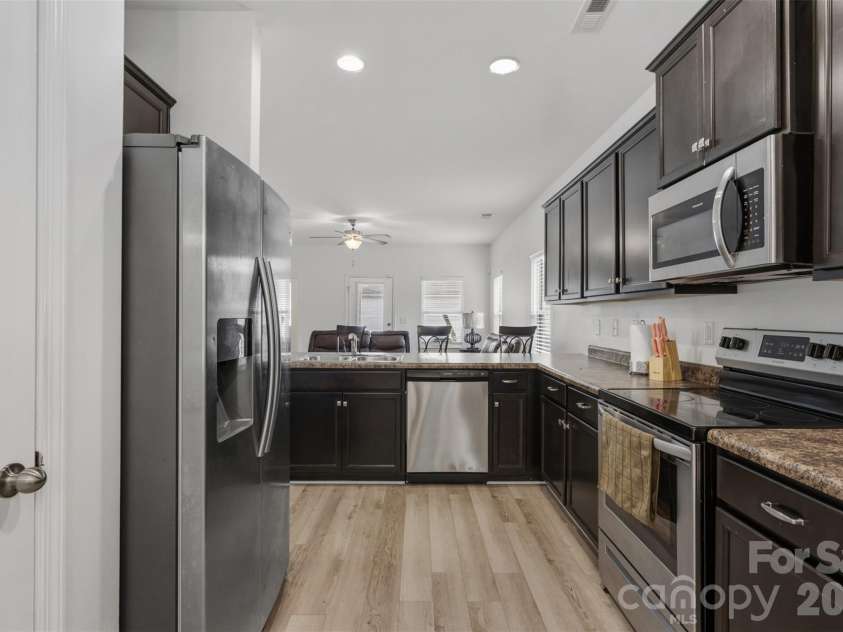 3200 Hickory Grove Drive, Monroe, NC 28110.  MLS# CAR4408208, YatesRealty ID 40094. Kitchen from Dining Room