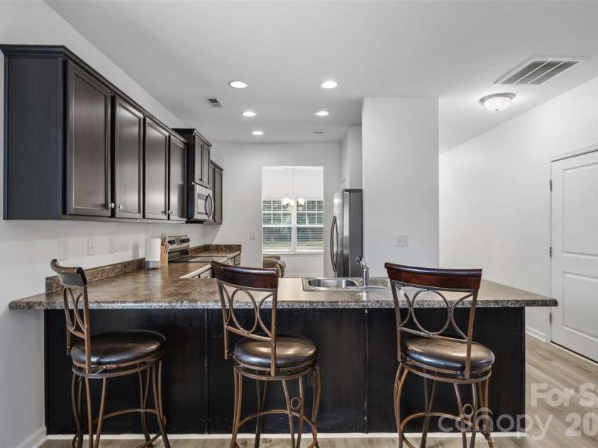 3200 Hickory Grove Drive, Monroe, NC 28110.  MLS# CAR4408208, YatesRealty ID 40094. Kitchenn from Living Room