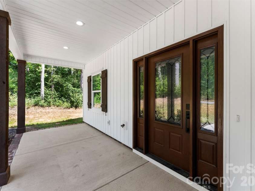 5005 Oconee Drive, Stanley, NC 28164.  MLS# CAR4402337, YatesRealty ID 40096. Covered front porch with beautiful front door