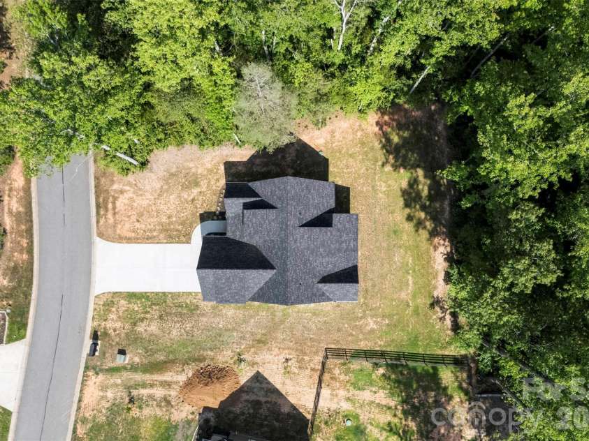 5005 Oconee Drive, Stanley, NC 28164.  MLS# CAR4402337, YatesRealty ID 40096. Trees to the left and behind you