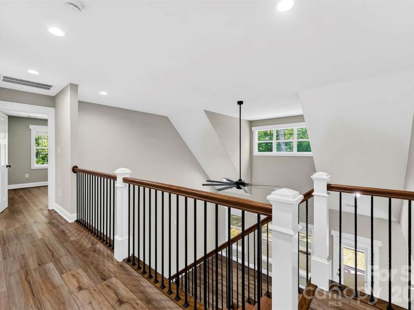 5005 Oconee Drive, Stanley, NC 28164.  MLS# CAR4402337, YatesRealty ID 40096. Upstairs hallway overlooking great room