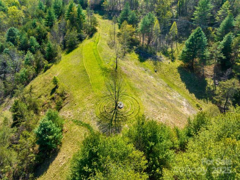 3717 Bend Of Ivy Road, Marshall, NC 28753.  MLS# CAR4209288, YatesRealty ID 401. Aerial photo of cleared area, and the Labrynth