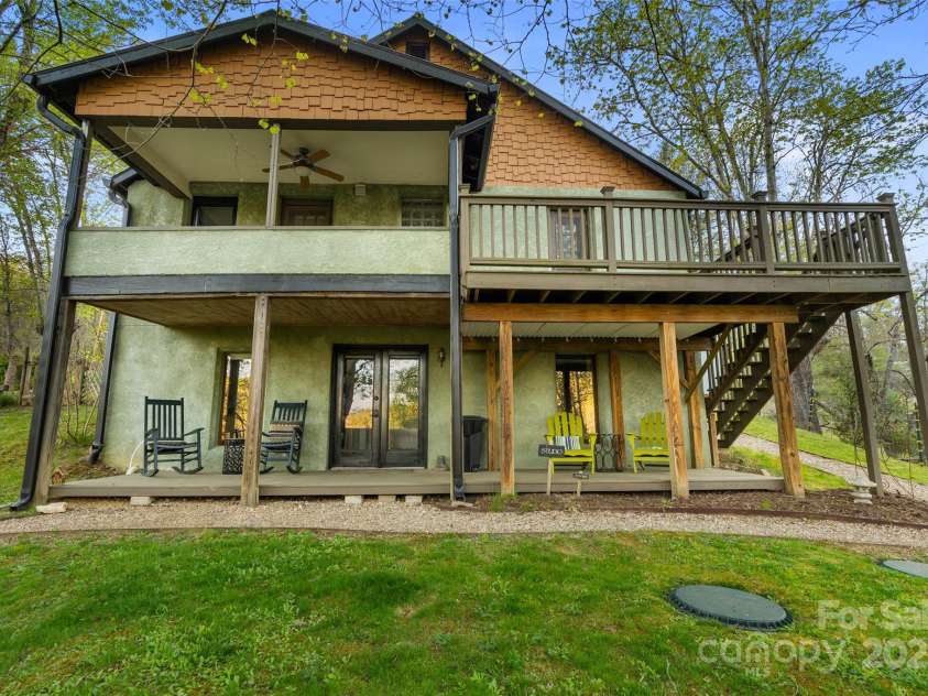 3717 Bend Of Ivy Road, Marshall, NC 28753.  MLS# CAR4209288, YatesRealty ID 401. Backside of the farmhouse has an abundance of deck space