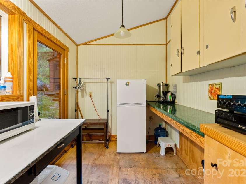 3717 Bend Of Ivy Road, Marshall, NC 28753.  MLS# CAR4209288, YatesRealty ID 401. Basic kitchen amenities for food storage and serving