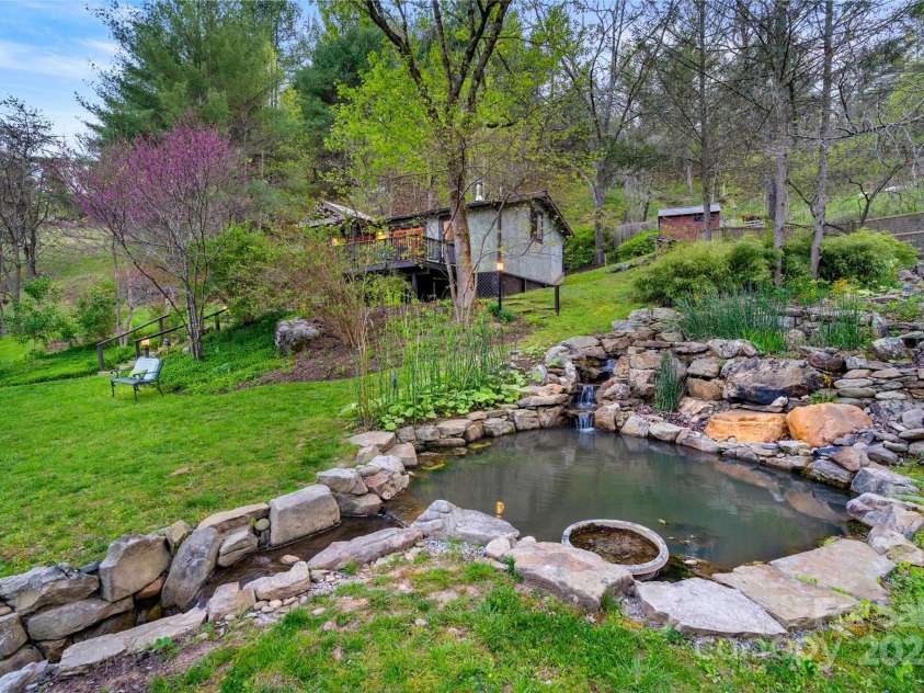 3717 Bend Of Ivy Road, Marshall, NC 28753.  MLS# CAR4209288, YatesRealty ID 401. Meditation area next to cascading waterfall