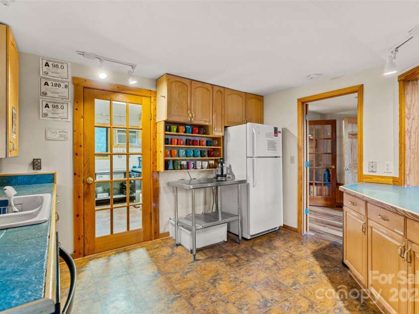 3717 Bend Of Ivy Road, Marshall, NC 28753.  MLS# CAR4209288, YatesRealty ID 401. Serving kitchen in main lodge