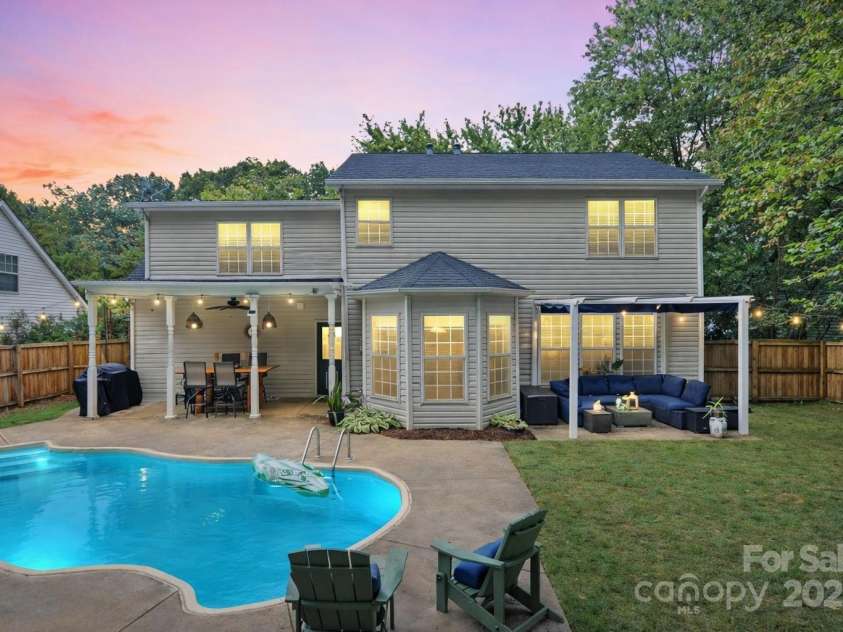 131 Misty Arbor Lane, Mooresville, NC 28117.  MLS# CAR4333134, YatesRealty ID 4010. Back exterior at dusk. *Photo has been virtually enhanced.*