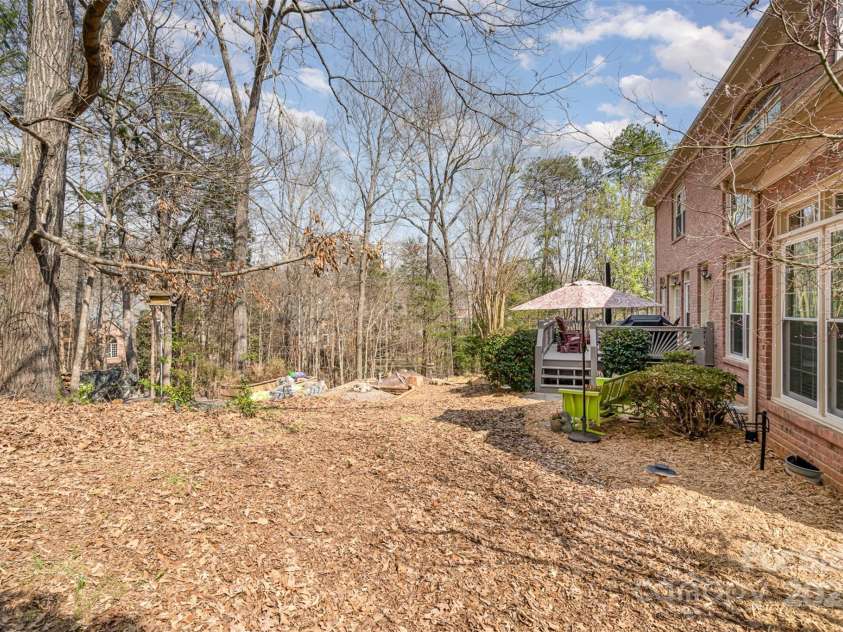 4828 Beth Lane, Harrisburg, NC 28075.  MLS# CAR4231144, YatesRealty ID 4010. Natural Areas in the Back Yard