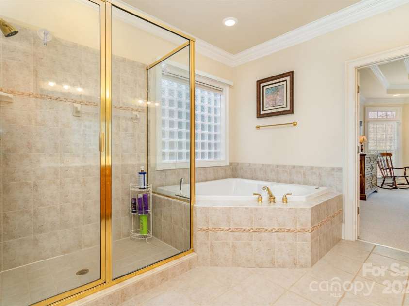 4828 Beth Lane, Harrisburg, NC 28075.  MLS# CAR4231144, YatesRealty ID 4010. Walk in Shower and Large Soaking Tub