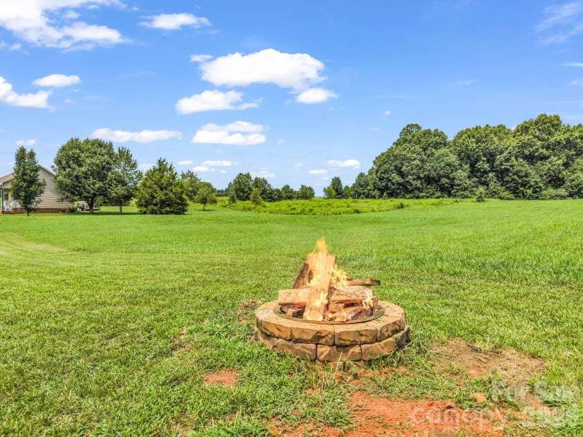 2630 Highway 182 Highway, Lincolnton, NC 28092.  MLS# CAR4405890, YatesRealty ID 40120. Firepit in back
