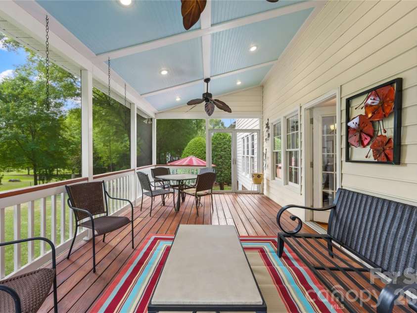 12338 Willingdon Road, Huntersville, NC 28078.  MLS# CAR4404461, YatesRealty ID 40138. Gorgeous and spacious screen deck facing the golf course and large back yard. There also a paver patio down the stairs from the porch that great for grilling.