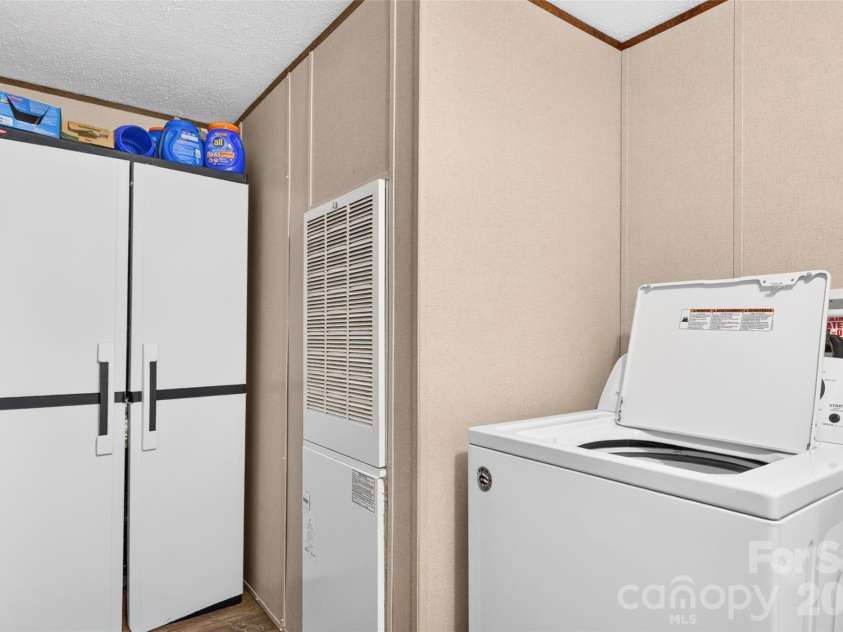5249 Antler Drive, Iron Station, NC 28080.  MLS# CAR4401538, YatesRealty ID 40139. Laundry Room
