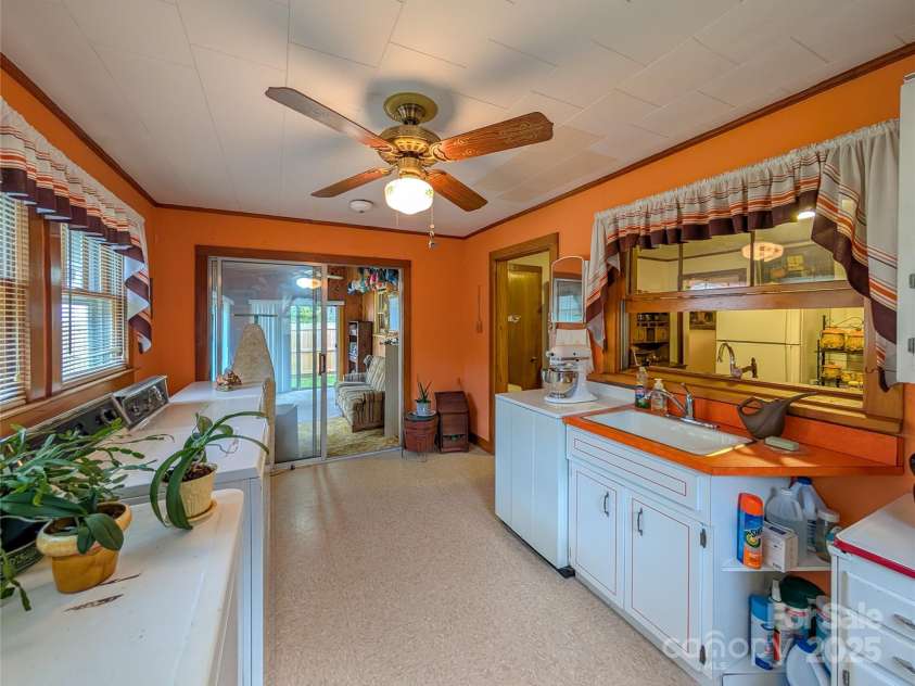 165 Cattail Creek Road, Burnsville, NC 28714.  MLS# CAR4298888, YatesRealty ID 4014. Additional view of laundry room off from kitchen.