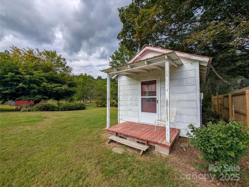 165 Cattail Creek Road, Burnsville, NC 28714.  MLS# CAR4298888, YatesRealty ID 4014. Adorable shed in backyard complete with electricity. Great studio potential!