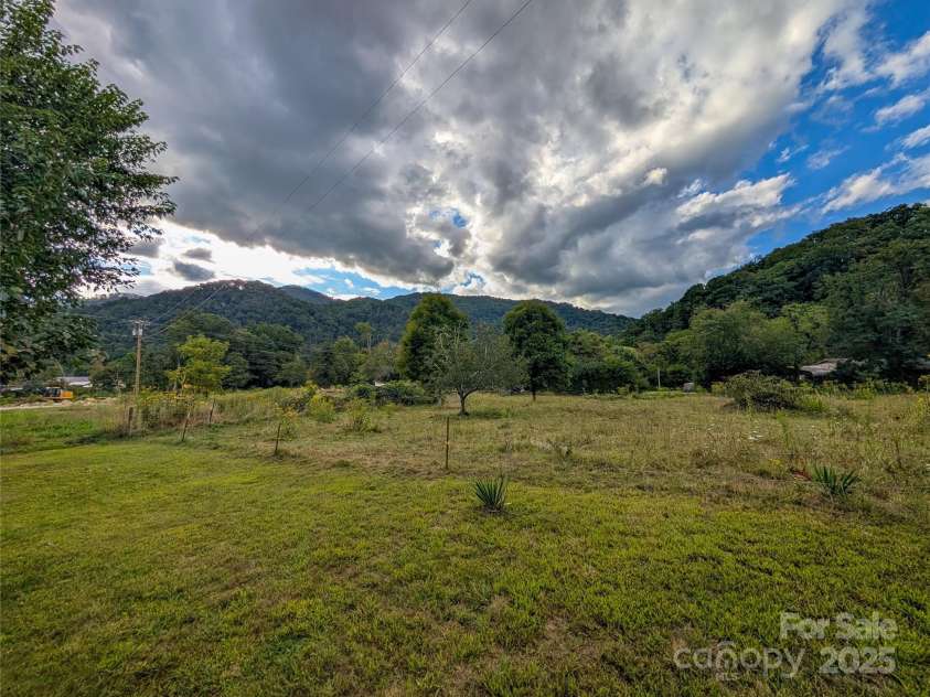165 Cattail Creek Road, Burnsville, NC 28714.  MLS# CAR4298888, YatesRealty ID 4014. Beautiful level land with mountain views! Ideal for pasture, farm, gardening, etc.