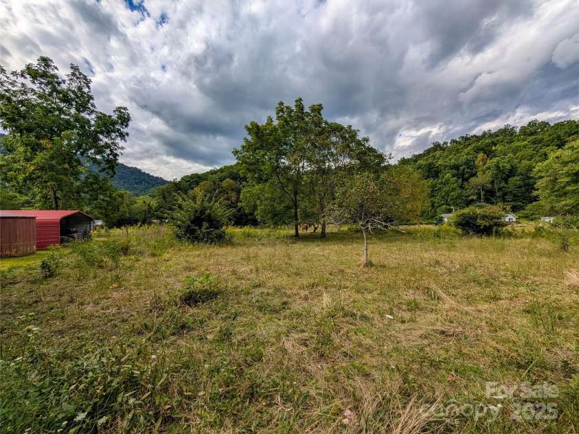 165 Cattail Creek Road, Burnsville, NC 28714.  MLS# CAR4298888, YatesRealty ID 4014. Beautiful level land with mountain views! Ideal for pasture, farm, gardening, etc.