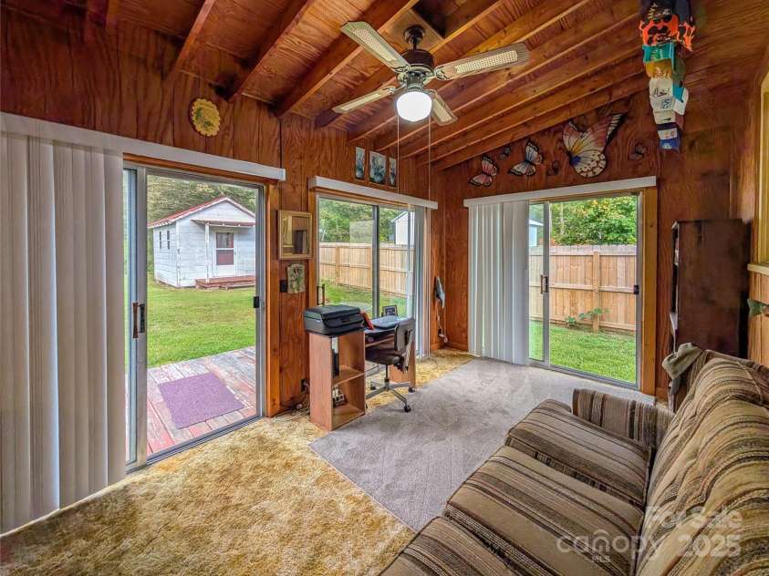 165 Cattail Creek Road, Burnsville, NC 28714.  MLS# CAR4298888, YatesRealty ID 4014. Sun Room with access to backyard. 