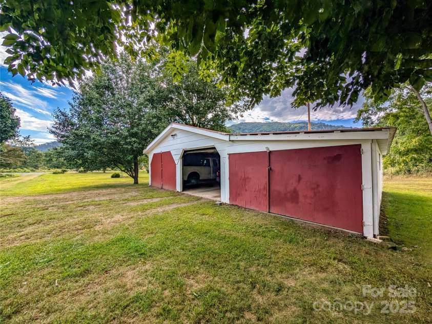 165 Cattail Creek Road, Burnsville, NC 28714.  MLS# CAR4298888, YatesRealty ID 4014. Two Car Garage with extra storage - great workshop or studio potential!
