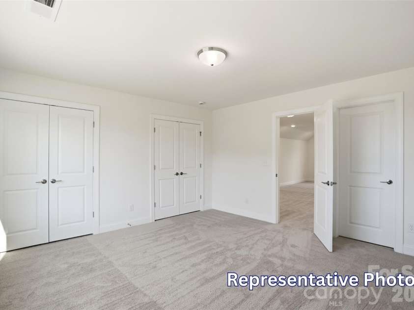 8470 Acadia Parkway, Sherrills Ford, NC 28673.  MLS# CAR4406421, YatesRealty ID 40142. Upper level bedroom