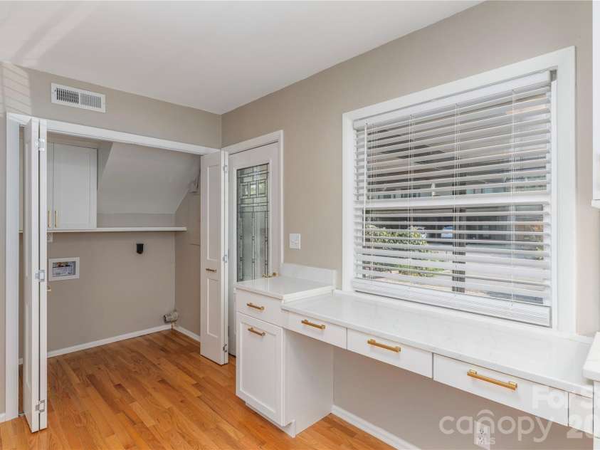 30 Maple Ridge Lane, Asheville, NC 28806.  MLS# CAR4408077, YatesRealty ID 40151. Convenient desk built in desk space, laundry room