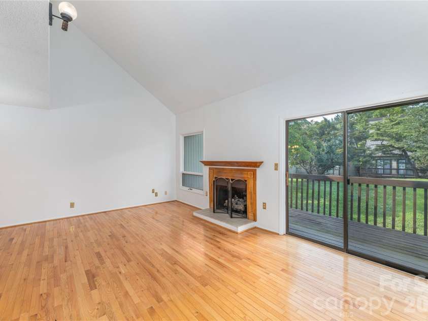 30 Maple Ridge Lane, Asheville, NC 28806.  MLS# CAR4408077, YatesRealty ID 40151. Gas logs, back deck looking out over grassy common area.